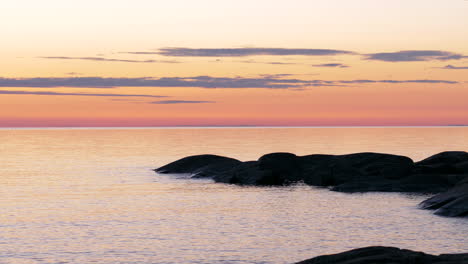 Amazing-sunset-over-sea-and-vibrant-pink-orange-colorful-sky