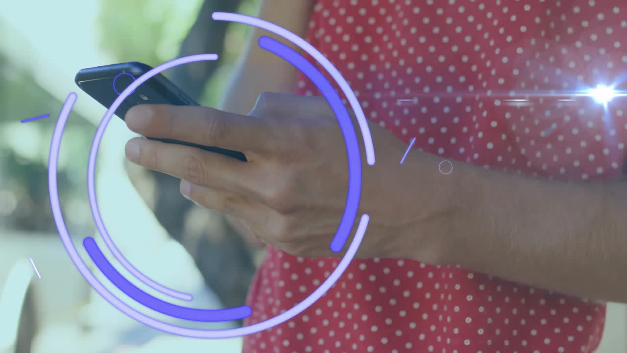 Using smartphone with animation overlay, person wearing red polka dot shirt