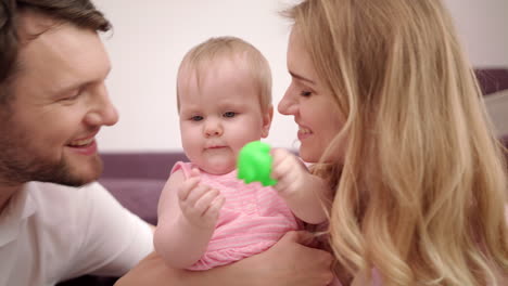 close-up view of happy family with baby