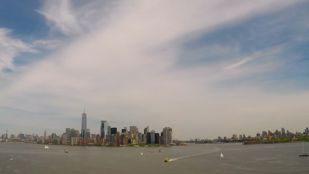 Timelapse of New York skyline with ferries and boats going in and out of the Upper Bay