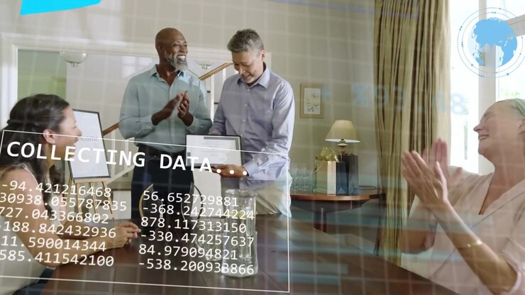 Two men handing tablet at table, presenting and sparking business data charts with team clapping