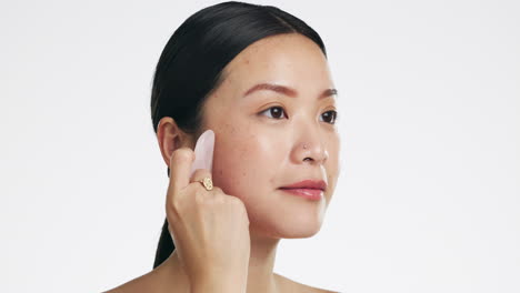 gua sha, beauty and woman massaging face isolated