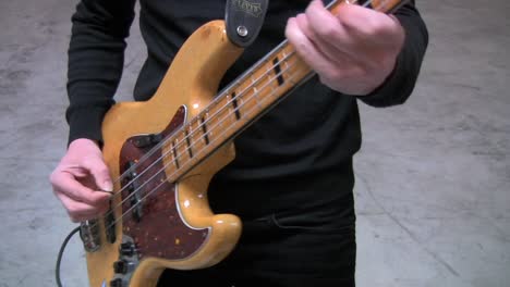 bass guitar being played