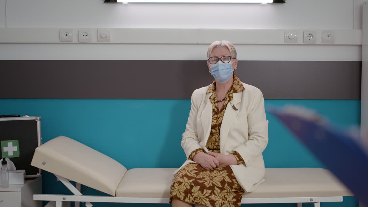 Retired patient waiting to receive consultation from medical team