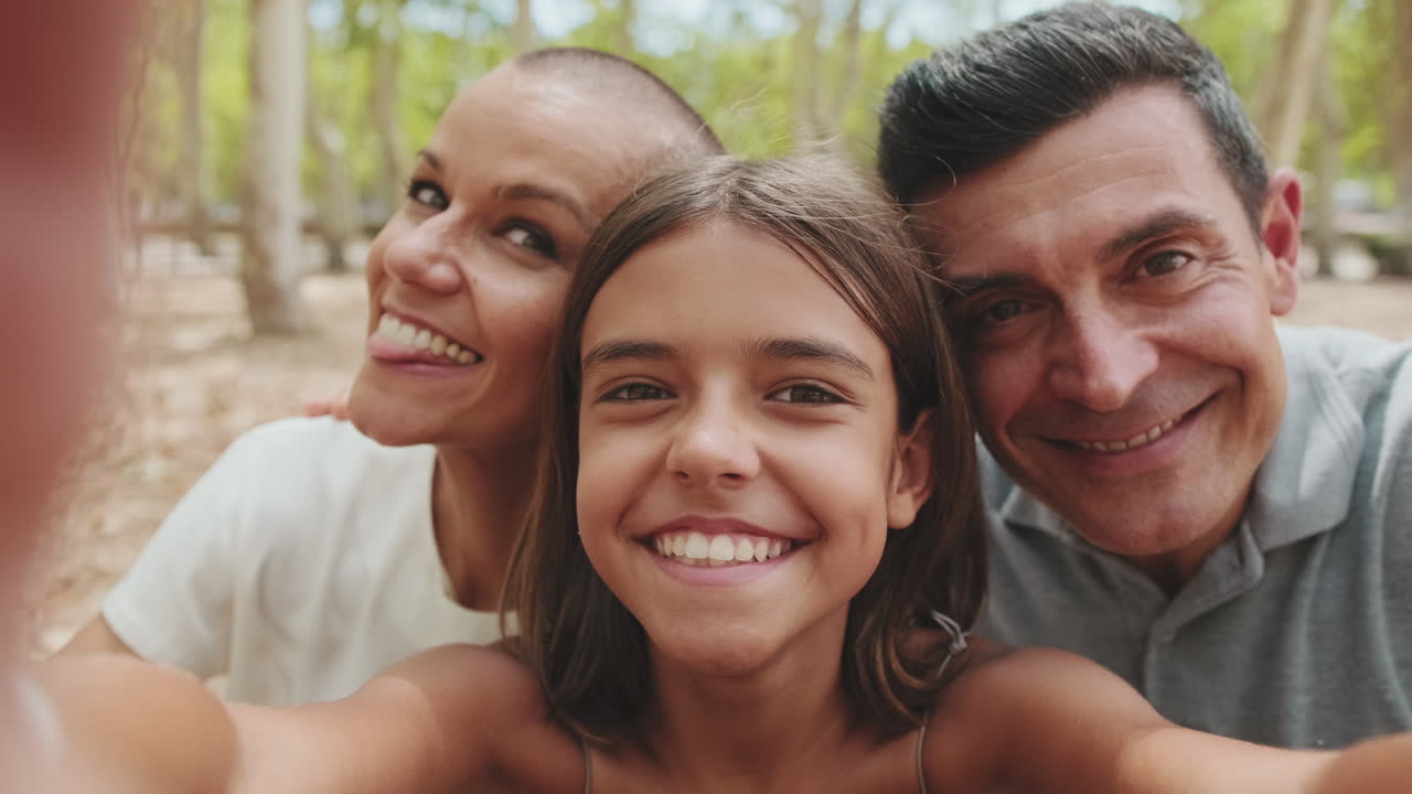 Happy Family Taking a Selfie Together in the Park