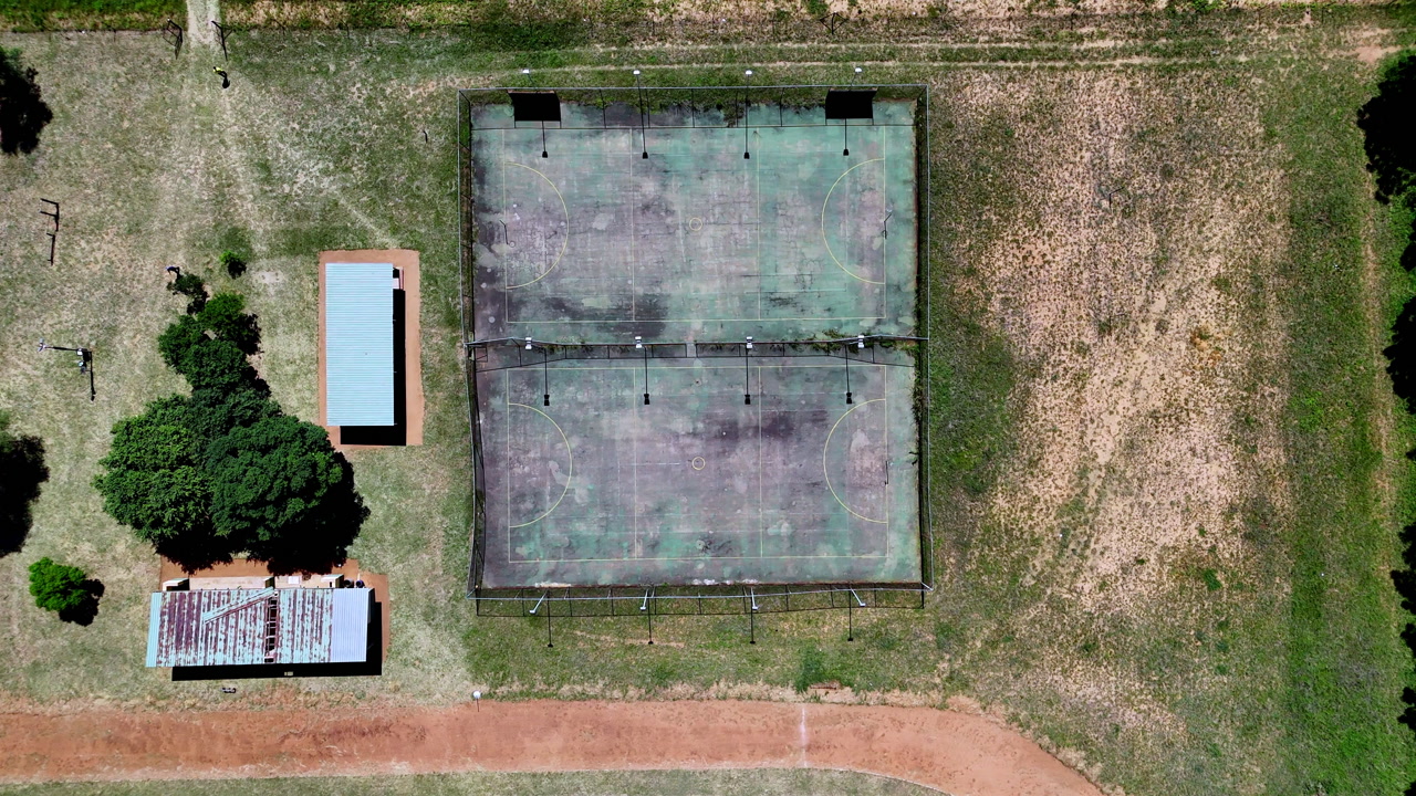 Old sports facilities of rural farming town school in South Africa, aerial
