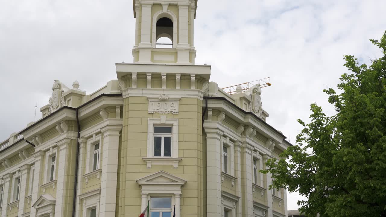 Vilnius, Lithuania – 29 May 2022. Statue of a woman atop an old building.
