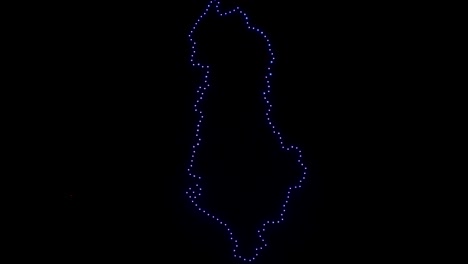 mapa de albania creado por drones voladores en el cielo nocturno con luces iluminadas, pantalla de nueva tecnología