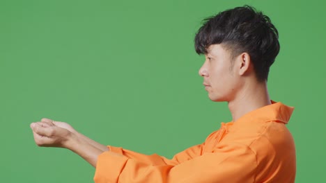 man in orange uniform profile view