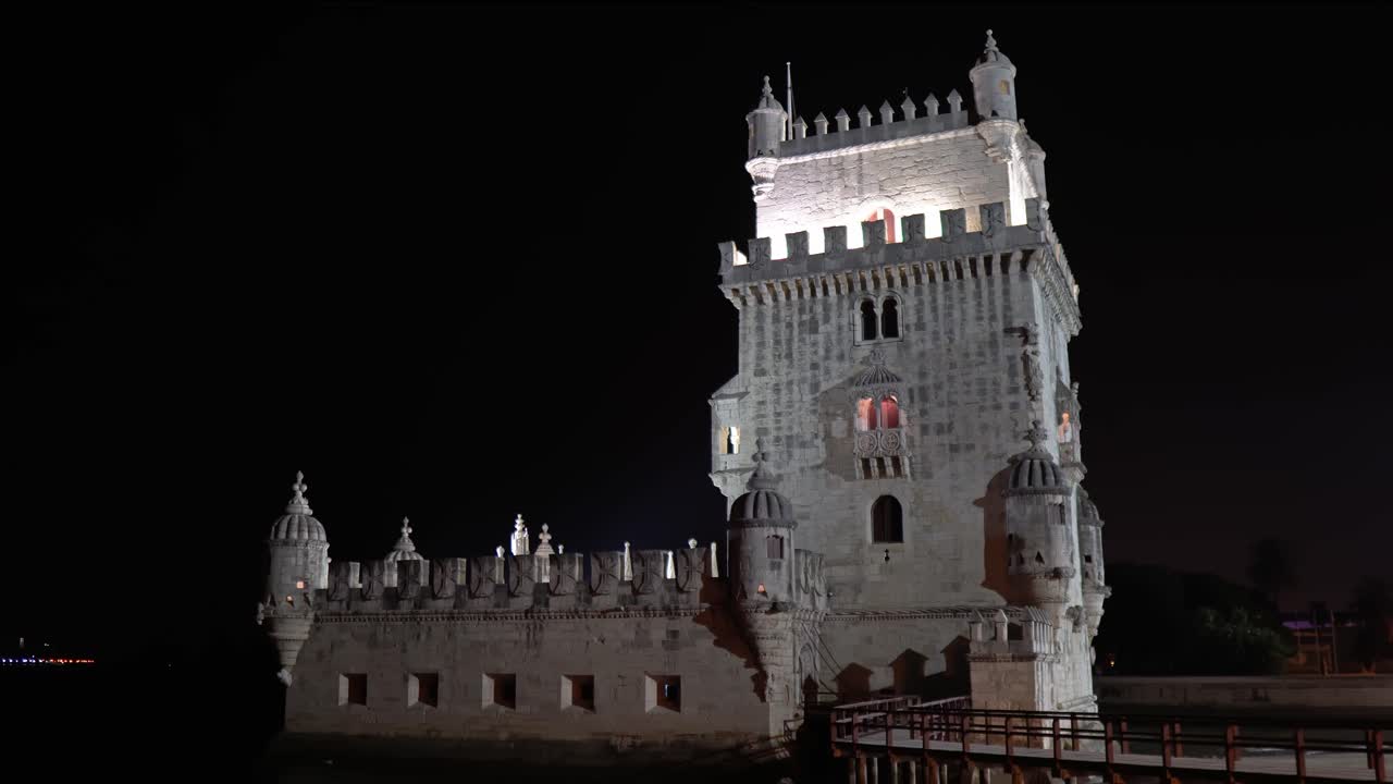 Beautiful illuminated Bel&eacute;m Tower at night from side view in Lisbon, Portugal