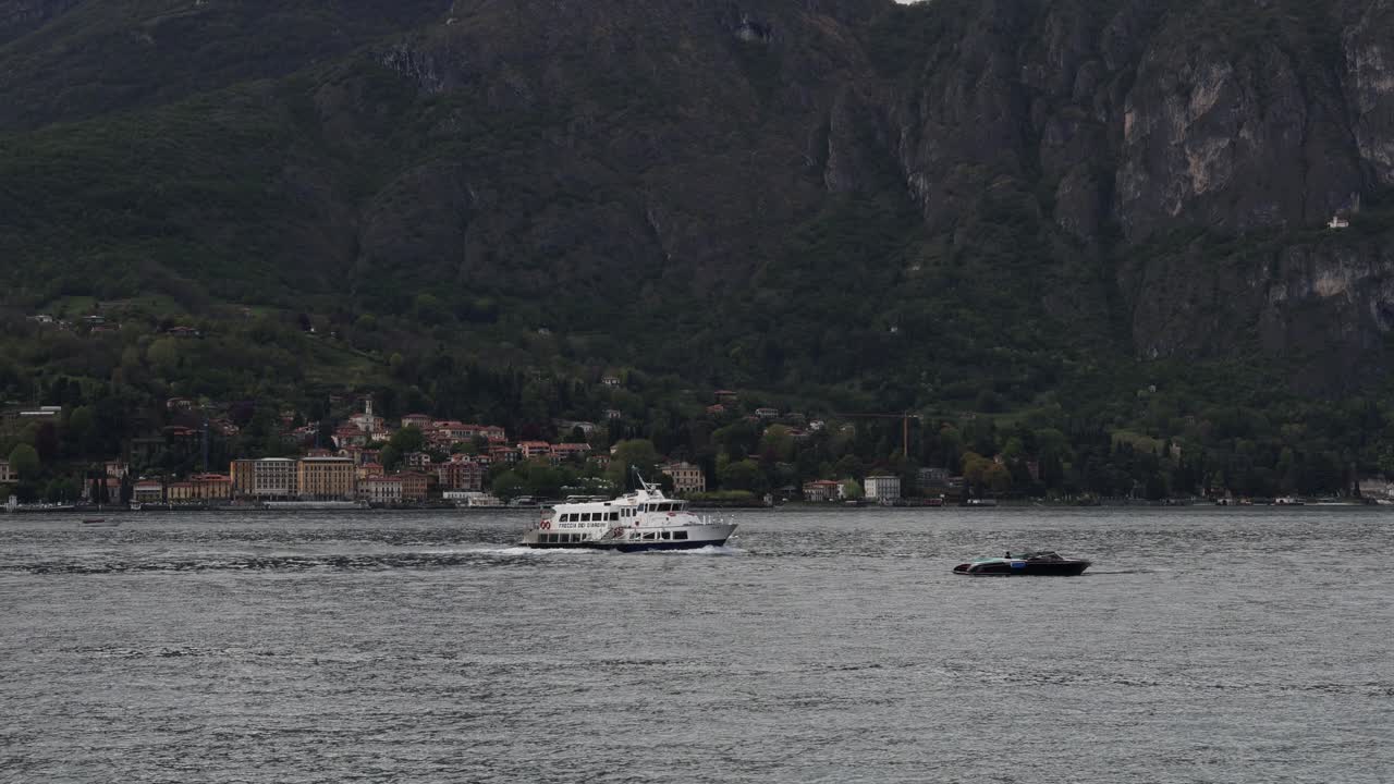 Heavily loaded ferry crossing lake Como, establisher