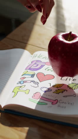 healthy lifestyle notebook with apple