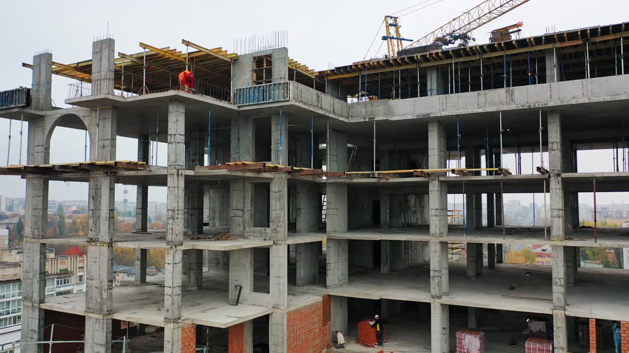 Building In The Process Of Construction. Construction site with bird eye in megacity