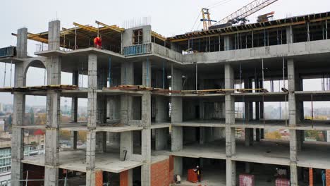 building in the process of construction. construction site with bird eye in megacity