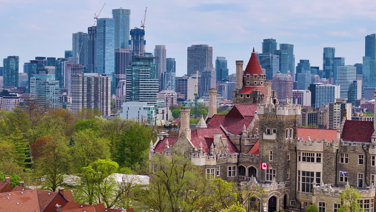 Aerial parallax shot of Casa Loma and downtown Toronto