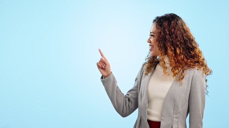 Happy business woman, pointing
