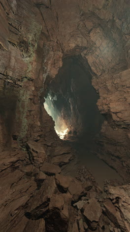 a view inside a cave with a light at the end