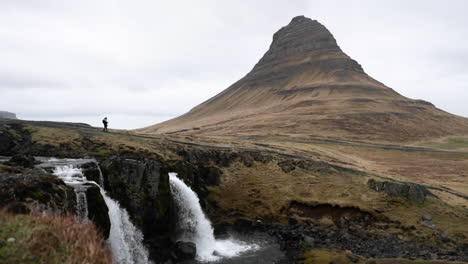 Wide-Angle-of-a-Small-Waterfall-in-Front-of-an-Iceland-Mountain-in-Slow-Motion