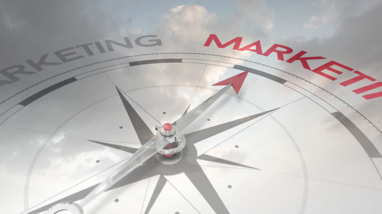 Compass needle pointing towards MARKETING with animation reflecting on glass surface