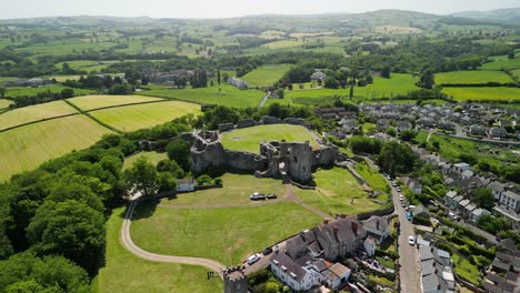 Denbigh-Castle-and-Town-Walls,-Denbighshire,-Wales---Aerial-drone-approach,-focus-on-castle-tower---June-23