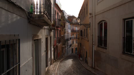 old colorful houses with narrow street in the historic town of lisbon, portugal