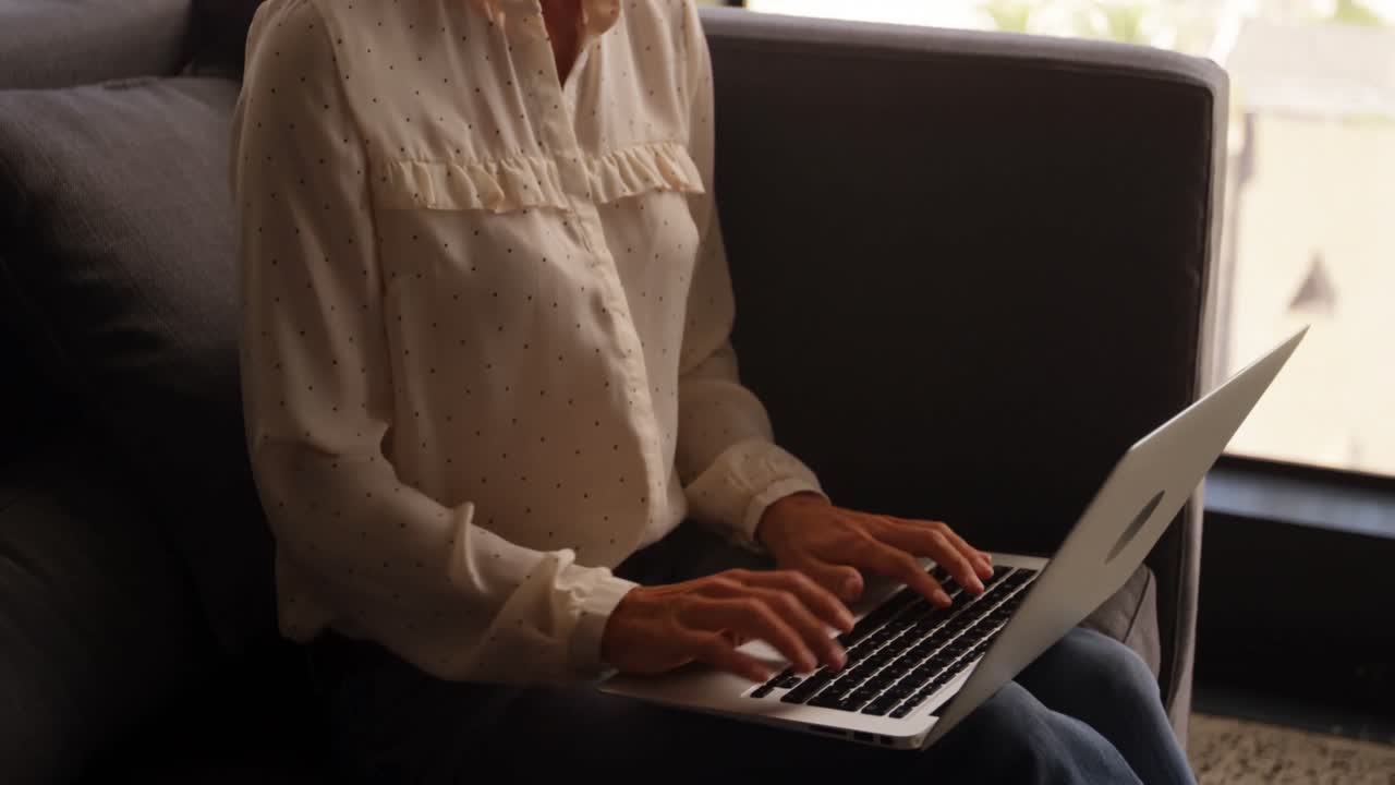 Businesswoman using laptop in office 4k