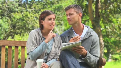 young couple doing a crossword
