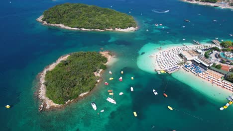 Paradise-Gateway:-Ksamil-Islands-Lagoon,-Azure-Sea,-White-Sand-Beach,-Summer-Holiday,-Swimming,-Sunbathing,-Boats,-and-Blissful-Vacation