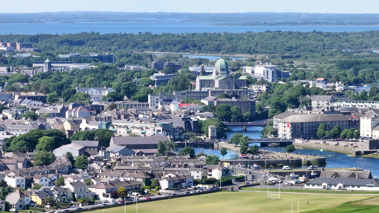 Galway cityscape with river Corrib, bridges and iconic buildings, Ireland drone