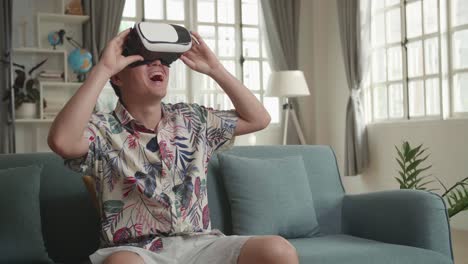 man wearing vr headset and enjoying virtual reality experience at home