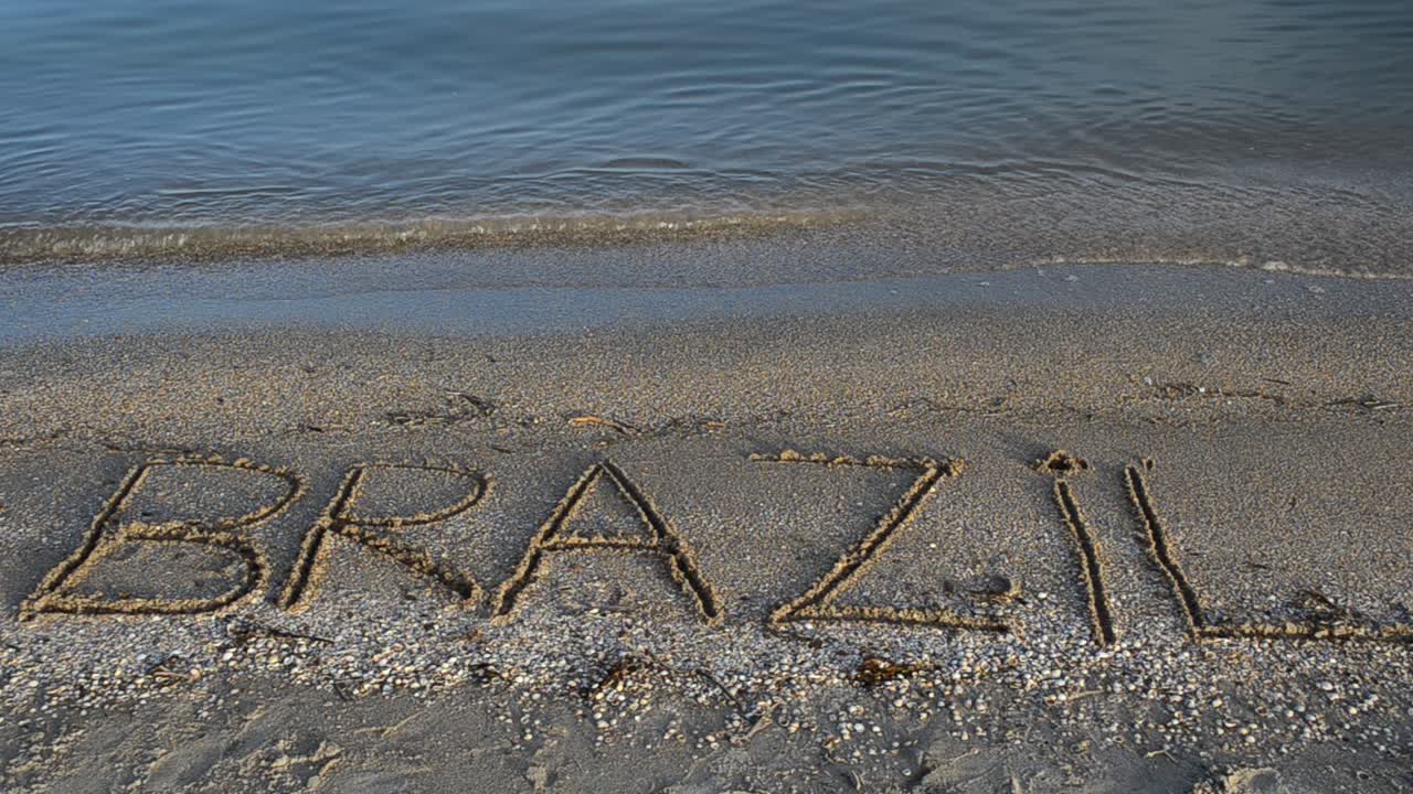 Brasilien, inskriptionen i sanden. Inskription på sand, stranden.