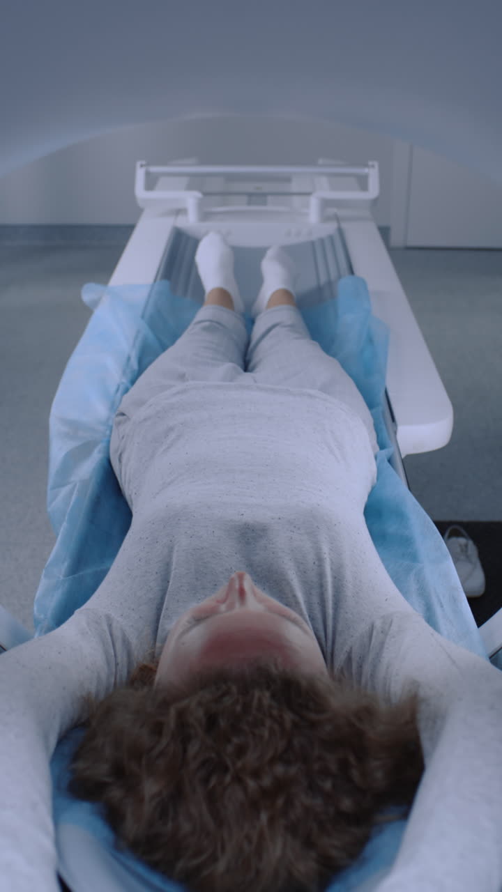 Woman undergoing MRI scan