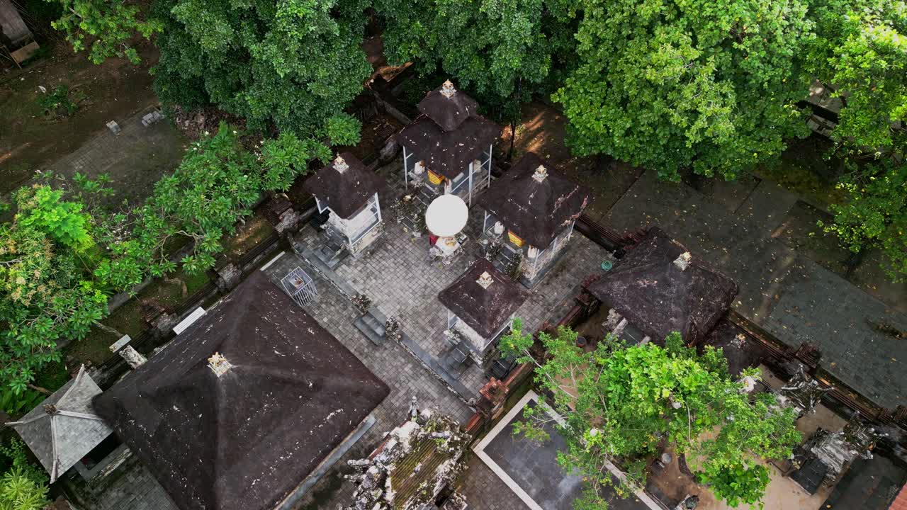Ubud temple courtyard in Bali presenting sacred shrines, spiritual structures, and historic stonework embraced by surrounding nature reflecting the timeless balance of culture and tradition