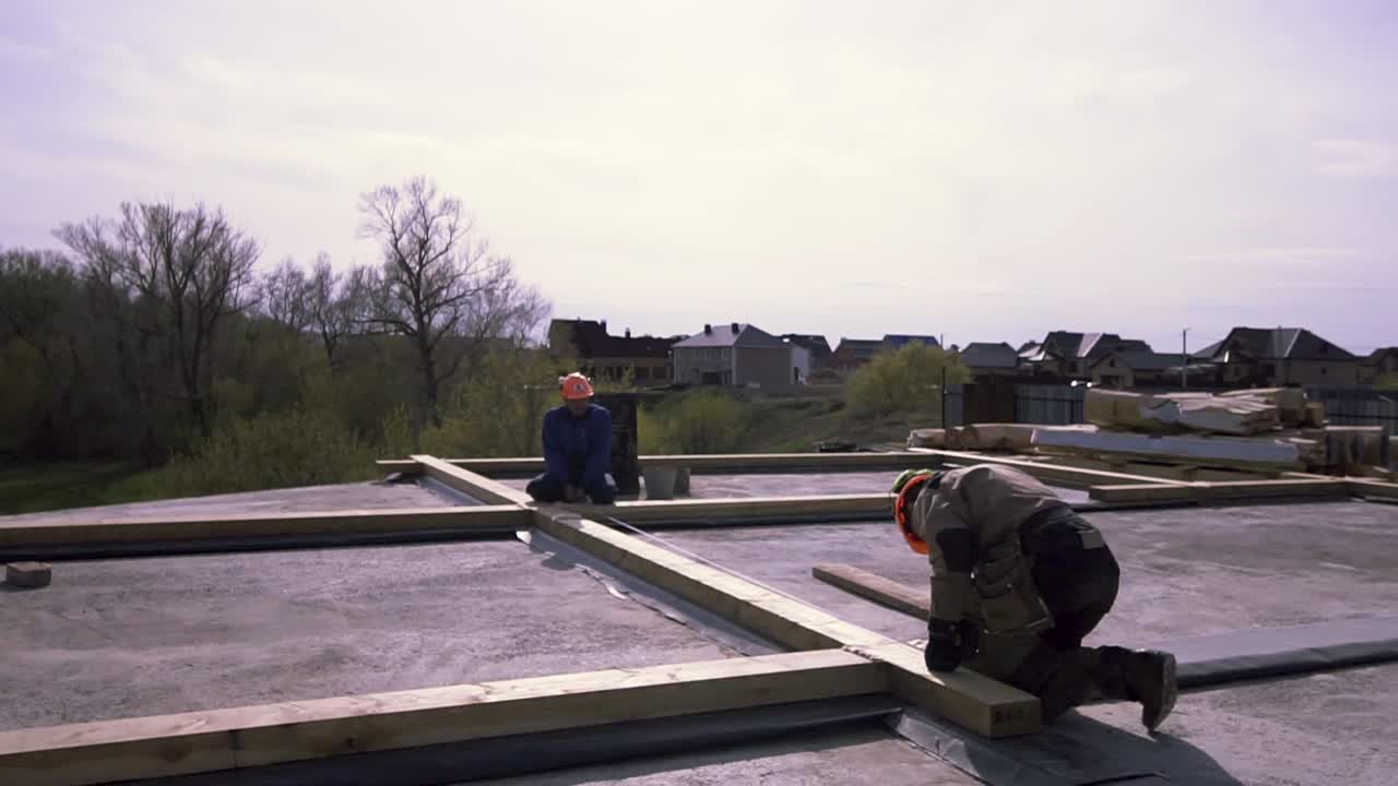 Construction Workers Framing a Roof