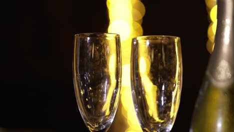 two champagne glasses at a festive celebration