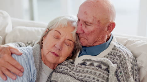 love, care and senior couple hugging on a sofa