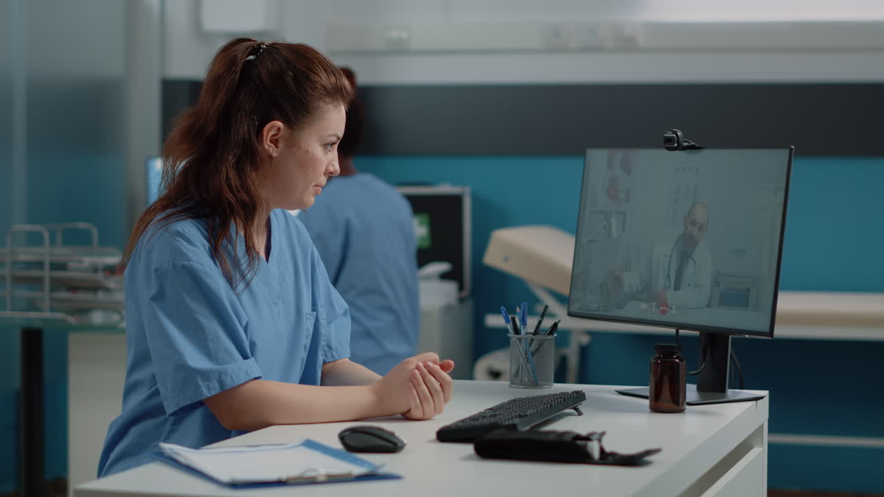 Nurse having online video call with doctor