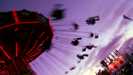 A-merry-go-round-spins-with-riders-against-the-sky-2