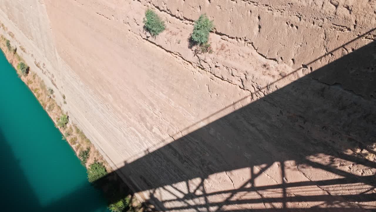 Aerial View of a Canal with a Bridge Shadow
