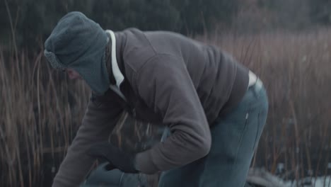 man loses balance in row boat starts laughing