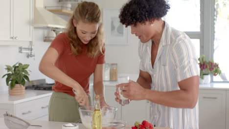 diverse couple preparing breakfast together in modern kitchen, mixing ingredients with joy, at home