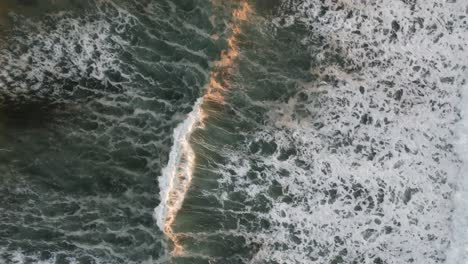 4k aerial drone shot of waves in ocean