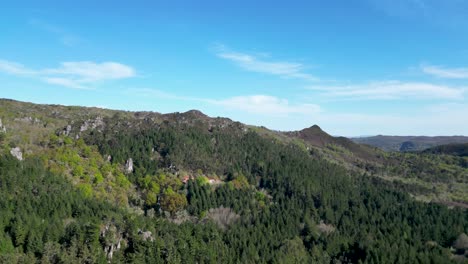 san pedros de rocas monastery through a spanish forest aerial view