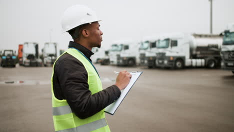 Worker writing on clipboard