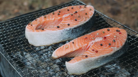 Grilling-salmon-fillet-on-smoking-grill.-Close-up-salmon-fillet-on-grill