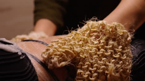 woman getting a body scrub