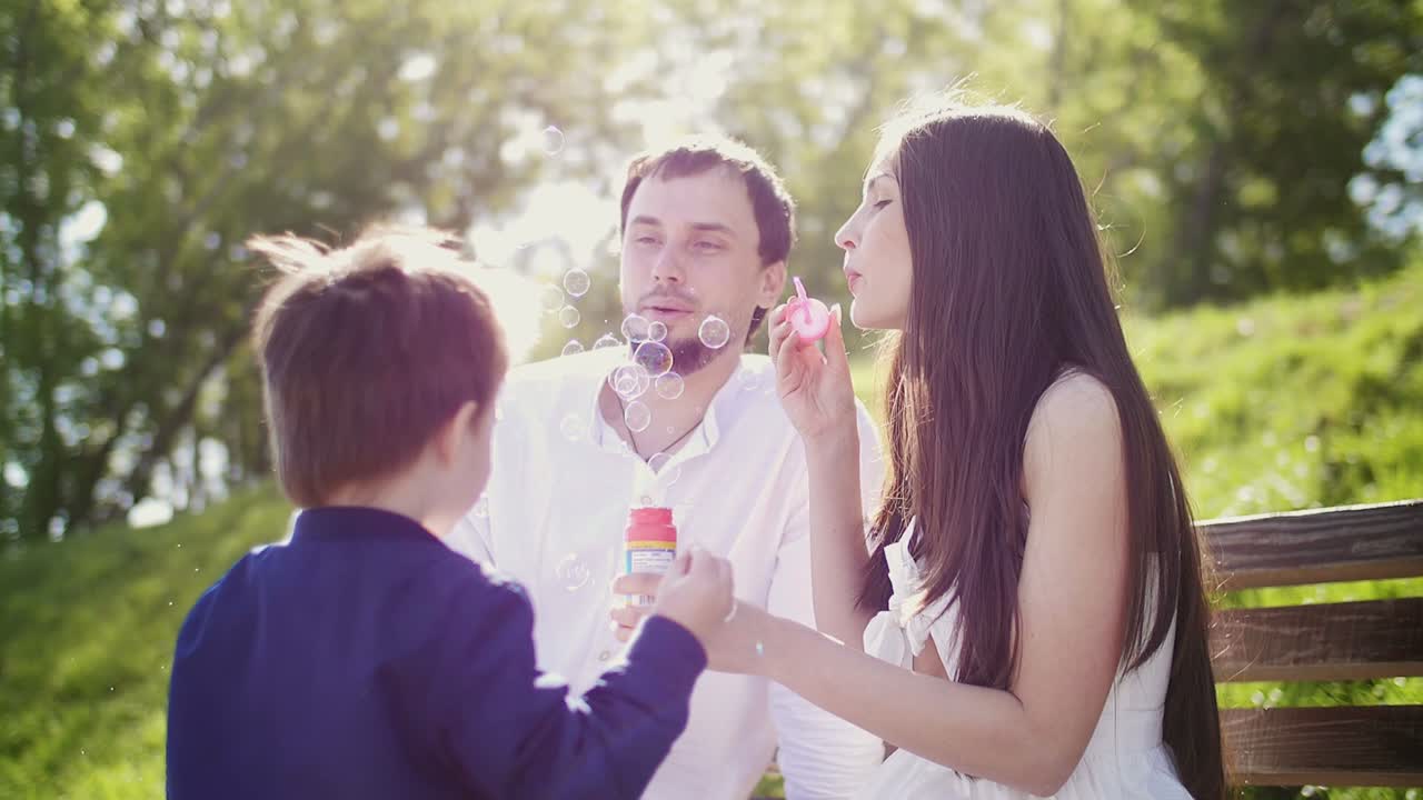 Family enjoying bubbles in a park