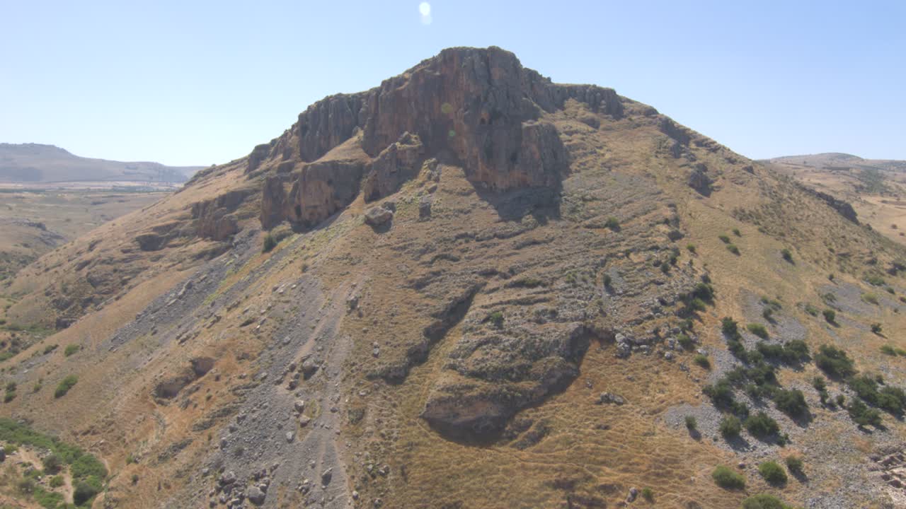 Epic aerial shot of giant cliff from mountain arbel during summer in holy Israel