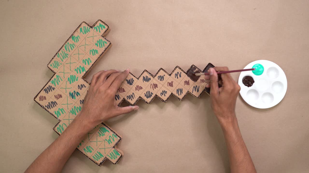 Hand painting cardboard box crafts, overhead pickaxe crafts