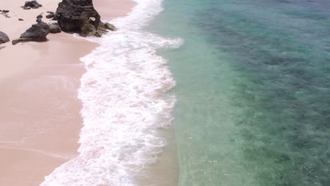 reveal shot of pantai mbawana during a cloudy day with no people, aerial